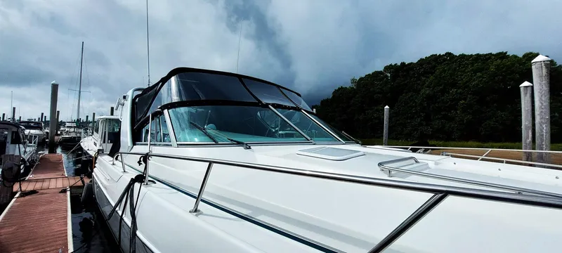Slide: The Image of 1998 Formula 41 PC yacht docked under cloudy skies. - 32