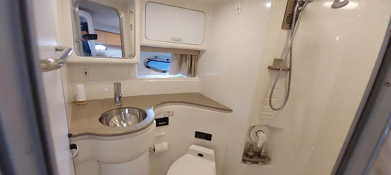 Slide: The Image of 1998 Formula 41 PC bathroom with sink, toilet, and shower in compact, modern design. - 9