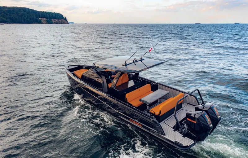 Slide: The Image of Luxury Virtue V10Top 2025 boat cruising on open water with scenic coastline. - 15