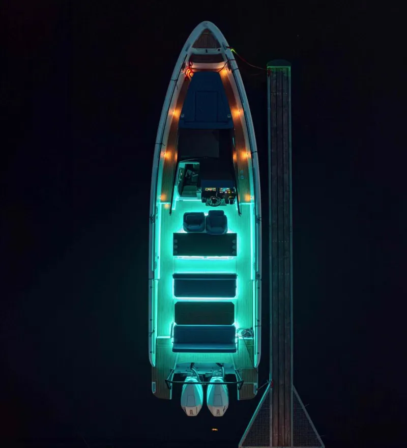 Slide: The Image of Aerial view of illuminated 2025 Virtue V10Top yacht docked at night. - 16