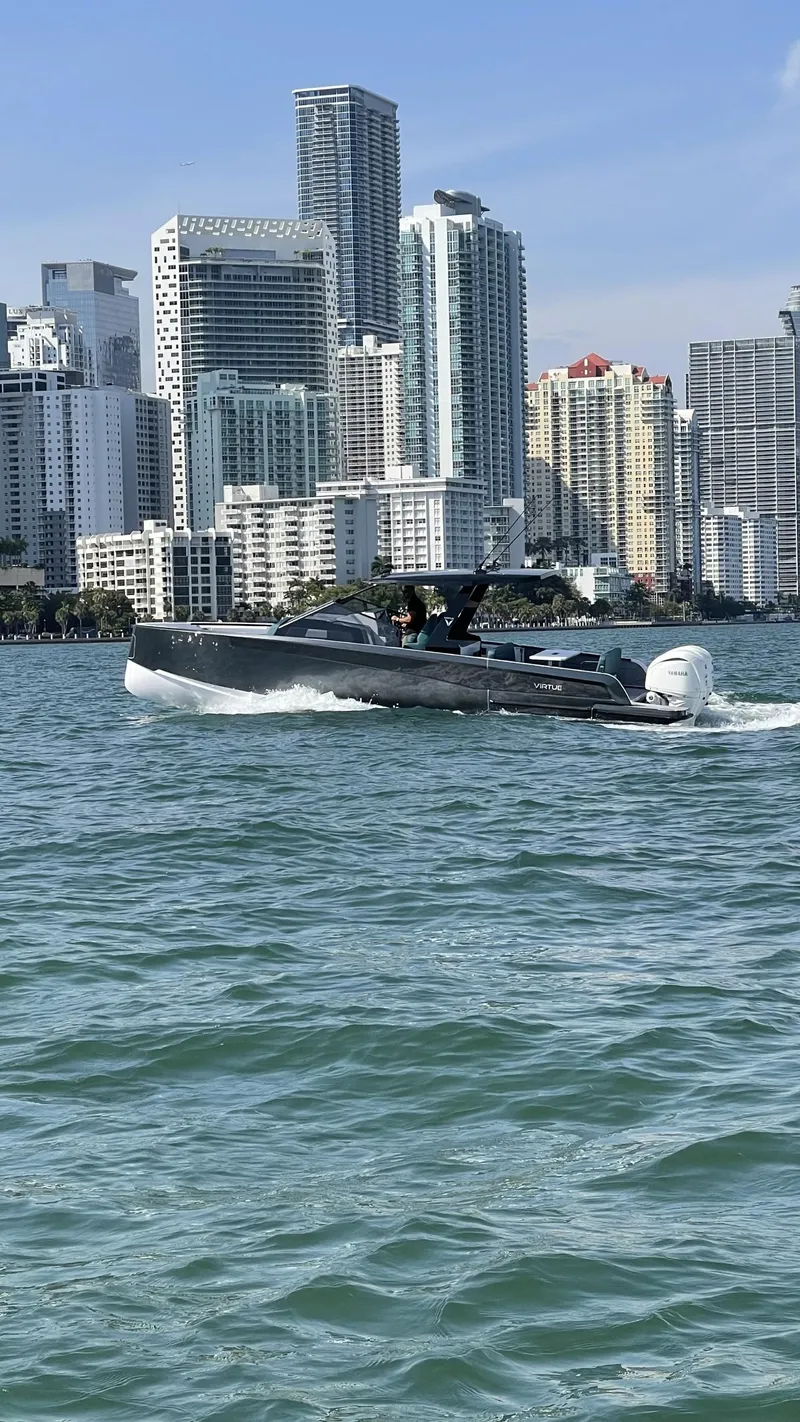 Slide: The Image of Modern Virtue V10Top boat cruising near city skyline, 2025 model. - 18