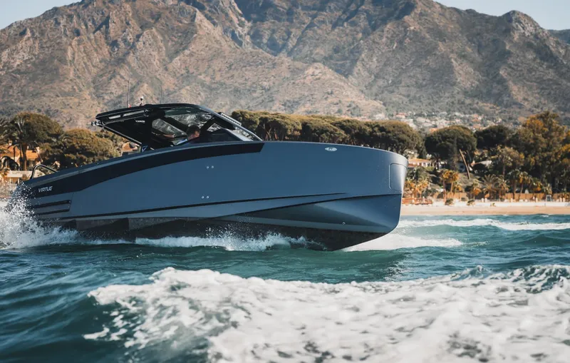 Slide: The Image of Luxury Virtue V10Top yacht cruising near scenic coastline, 2025 model. - 4
