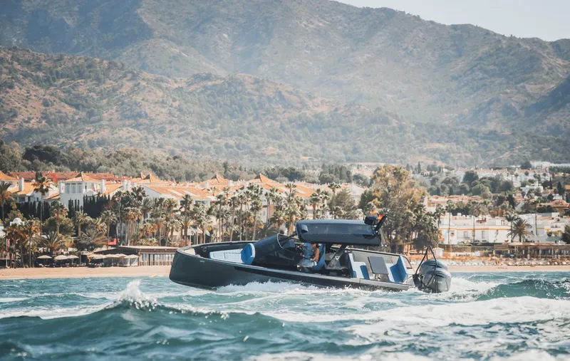 Slide: The Image of Modern Virtue V10Top boat cruising near scenic coastline, 2025 model. - 6