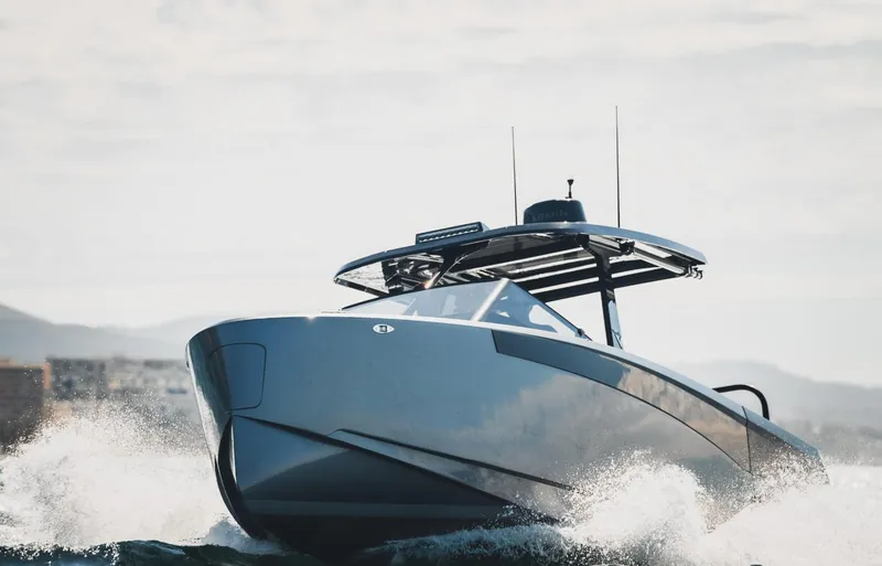 Slide: The Image of 2025 Virtue V10Top boat cruising on ocean waves, showcasing sleek design and modern features. - 7