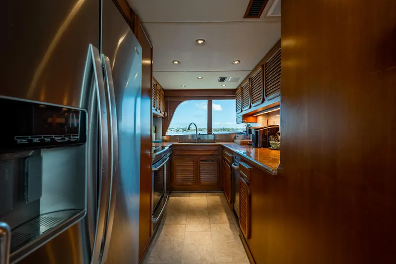 Slide: The Image of Luxurious kitchen interior of 1985 Cheoy Lee 90 Motor Yacht with stainless steel appliances. - 15