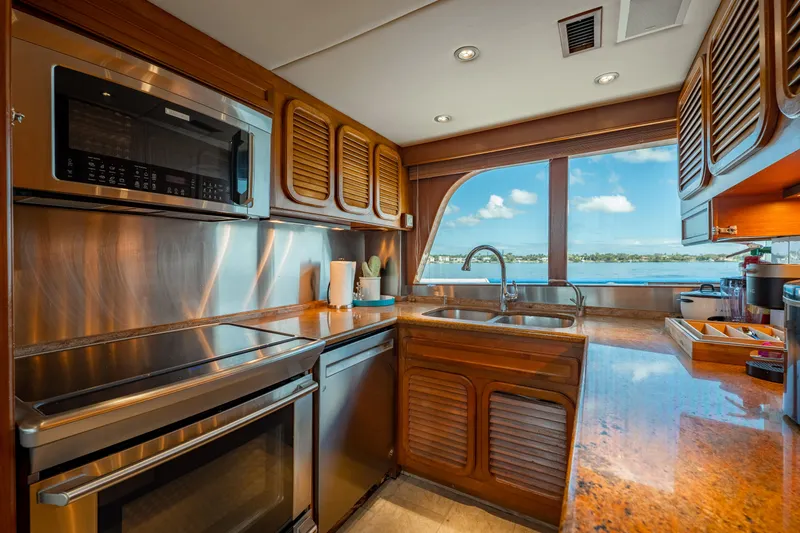 Slide: The Image of Luxurious kitchen interior of 1985 Cheoy Lee 90 Motor Yacht with ocean view. - 16