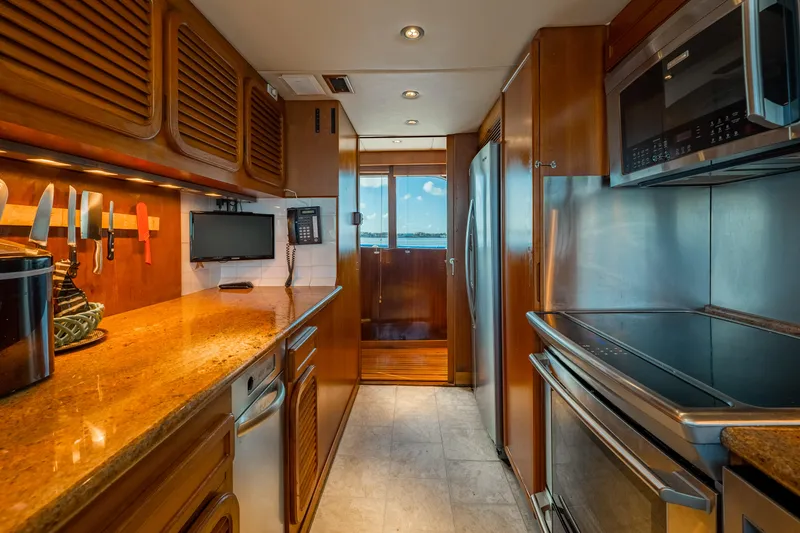 Slide: The Image of Luxurious kitchen interior of 1985 Cheoy Lee 90 Motor Yacht with modern appliances. - 17