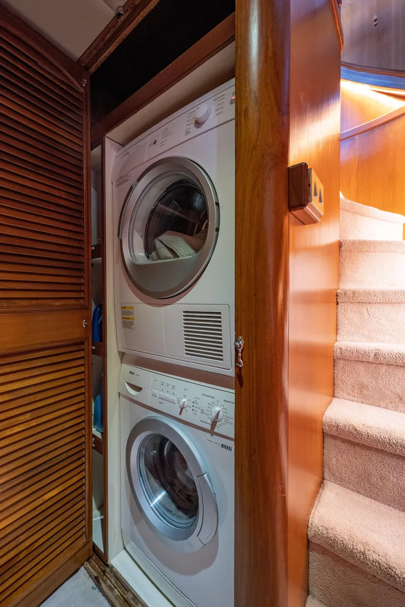 Slide: The Image of Stacked washer and dryer in 1985 Cheoy Lee 90 Motor Yacht interior. - 19