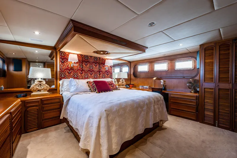 Slide: The Image of Luxurious bedroom interior of 1985 Cheoy Lee 90 Motor Yacht with elegant wood finishes. - 21