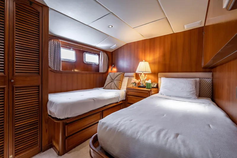 Slide: The Image of Interior of 1985 Cheoy Lee 90 Motor Yacht with twin beds and wooden paneling. - 29