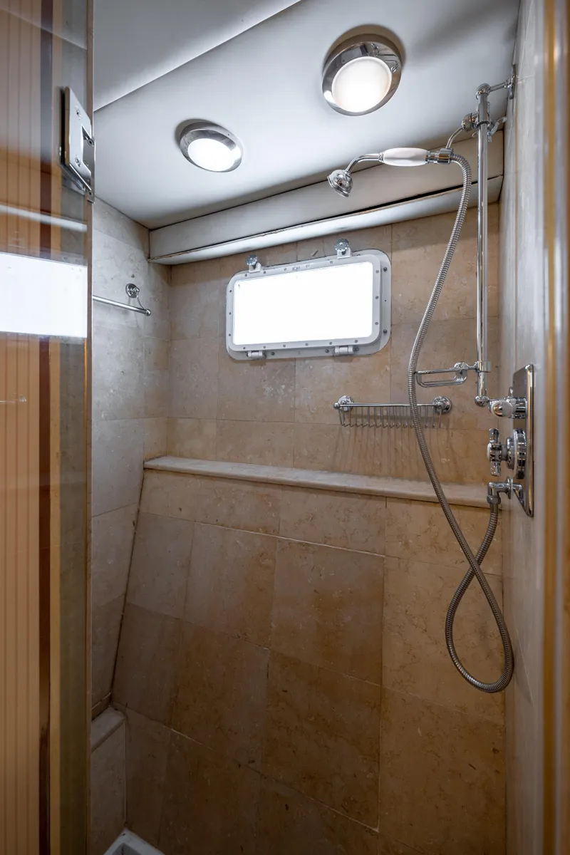 Slide: The Image of Shower area in 1985 Cheoy Lee 90 Motor Yacht with modern fixtures and natural lighting. - 33
