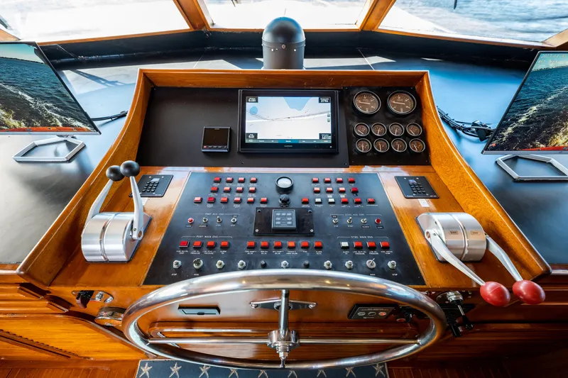 Slide: The Image of Pilothouse of 1985 Cheoy Lee 90 Motor Yacht with navigation controls and steering wheel. - 43
