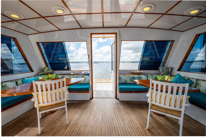 Slide: The Image of Interior of 1985 Cheoy Lee 90 Motor Yacht with ocean view and seating area. - 45