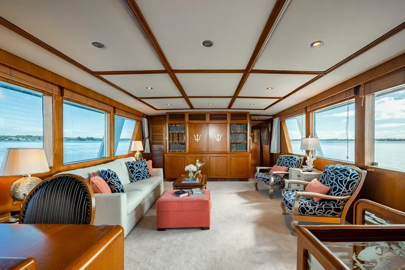 Slide: The Image of Luxurious interior of 1985 Cheoy Lee 90 Motor Yacht with elegant seating and panoramic windows. - 9