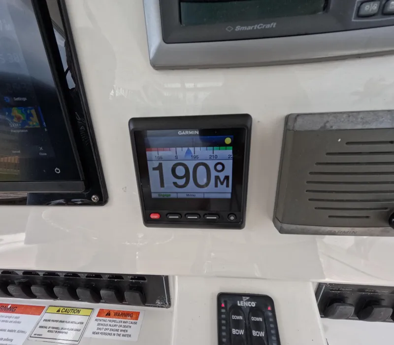 Slide: The Image of Garmin marine display on 2013 Boston Whaler 320 Outrage dashboard, showing 190 meters. - 7