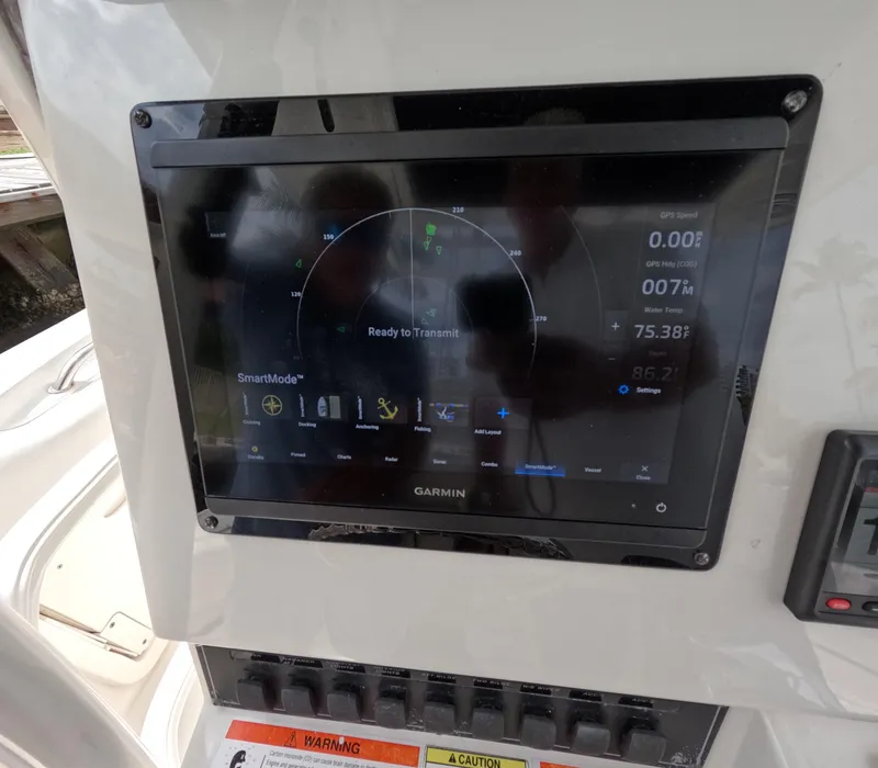 Slide: The Image of Garmin navigation display on 2013 Boston Whaler 320 Outrage boat dashboard. - 8