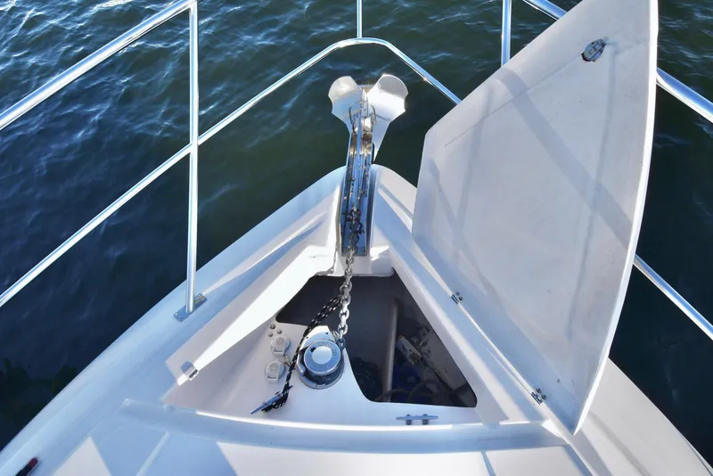 Slide: The Image of Bow of 2010 Neptunus 58 yacht with anchor chain and open hatch. - 19