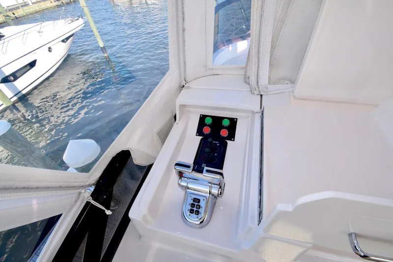 Slide: The Image of Control panel on a 2010 Neptunus 58 yacht, docked by the water. - 26