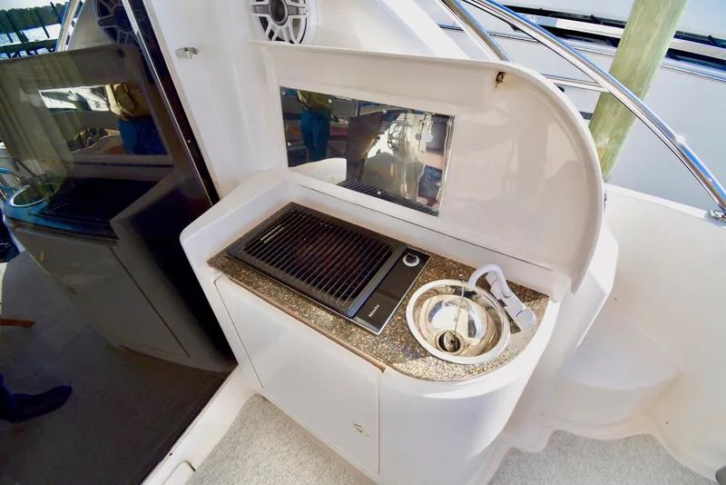 Slide: The Image of Outdoor kitchenette on a 2010 Neptunus 58 yacht with grill and sink. - 29