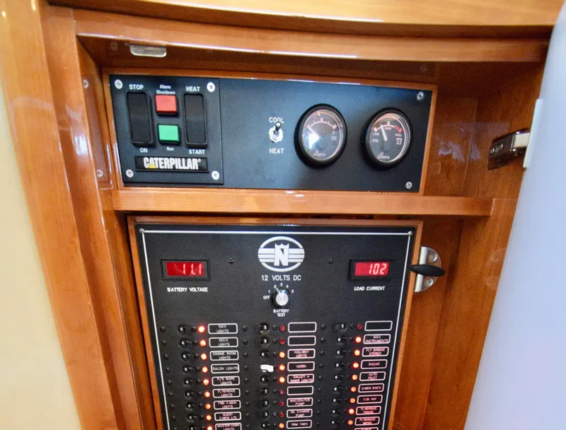 Slide: The Image of Control panel of a 2010 Neptunus 58 yacht with Caterpillar engine indicators. - 5