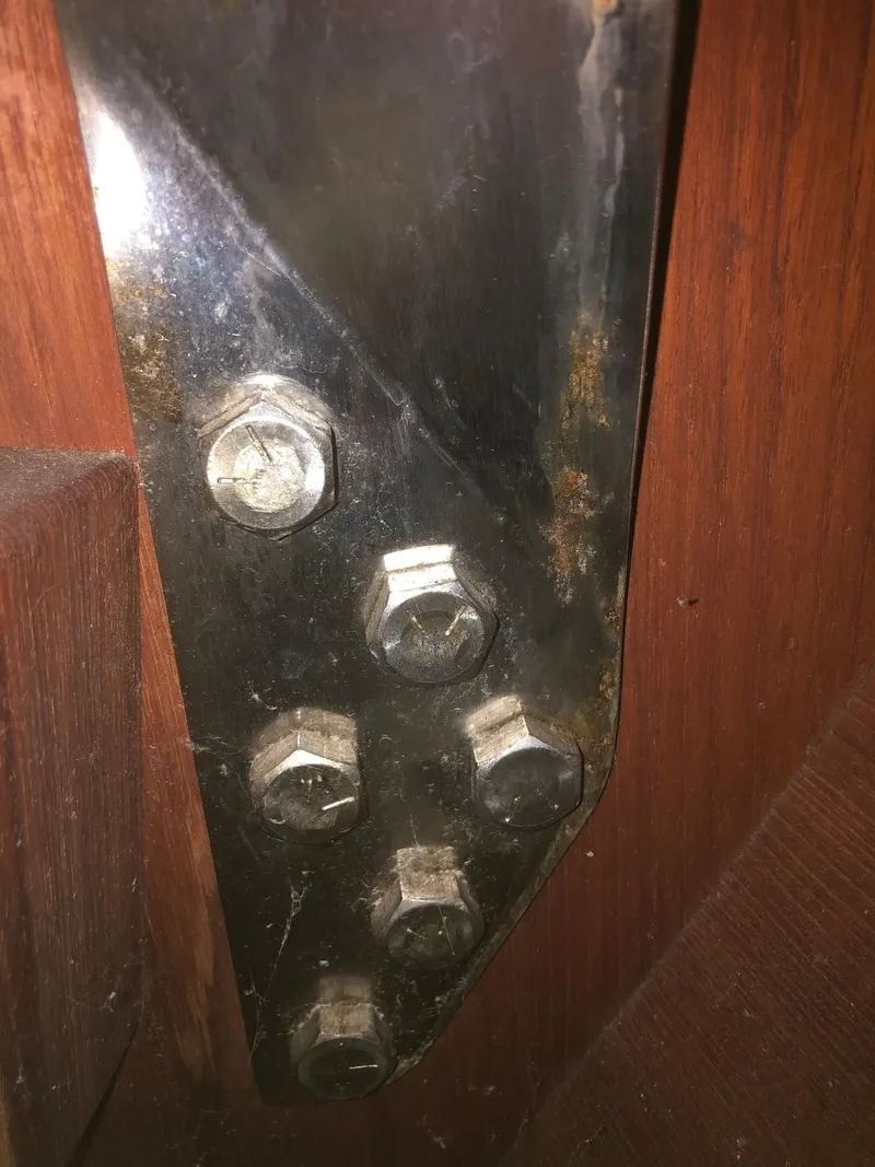 Slide: The Image of Close-up of metal bolts on a 1984 Tartan T-33 sailboat. - 11