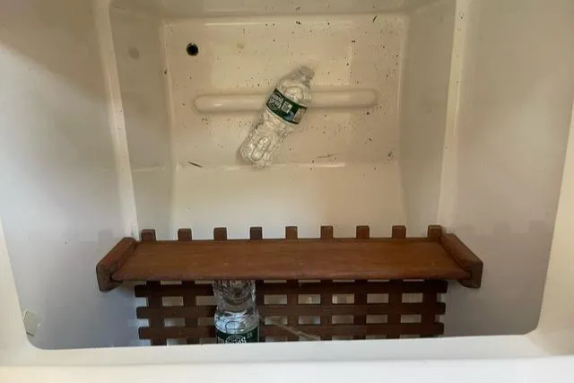 Slide: The Image of Empty cooler with water bottles inside, Tartan T-33 model, 1984. - 20