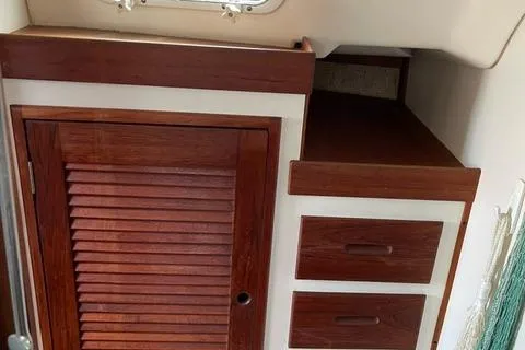 Slide: The Image of 1984 Tartan T-33 interior with wooden cabinet and drawers. - 23