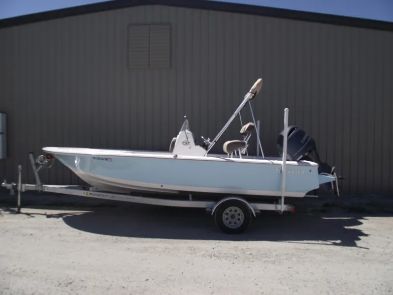 Slide: The Image of 2022 Tidewater 1910 Bay Max boat on trailer, parked outdoors. - 0