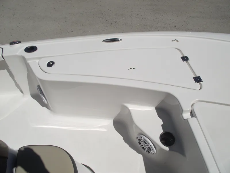 Slide: The Image of 2022 Tidewater 1910 Bay Max boat interior with storage compartment and speaker. - 11