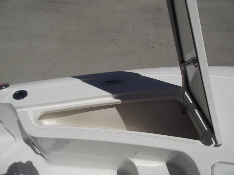 Slide: The Image of 2022 Tidewater 1910 Bay Max boat storage compartment open on deck. - 12