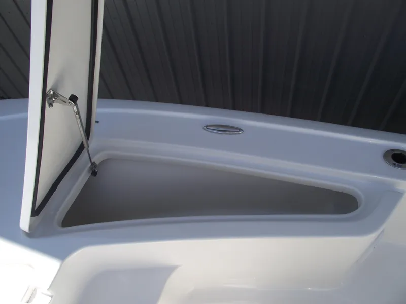 Slide: The Image of 2022 Tidewater 1910 Bay Max boat storage compartment with open hatch. - 14