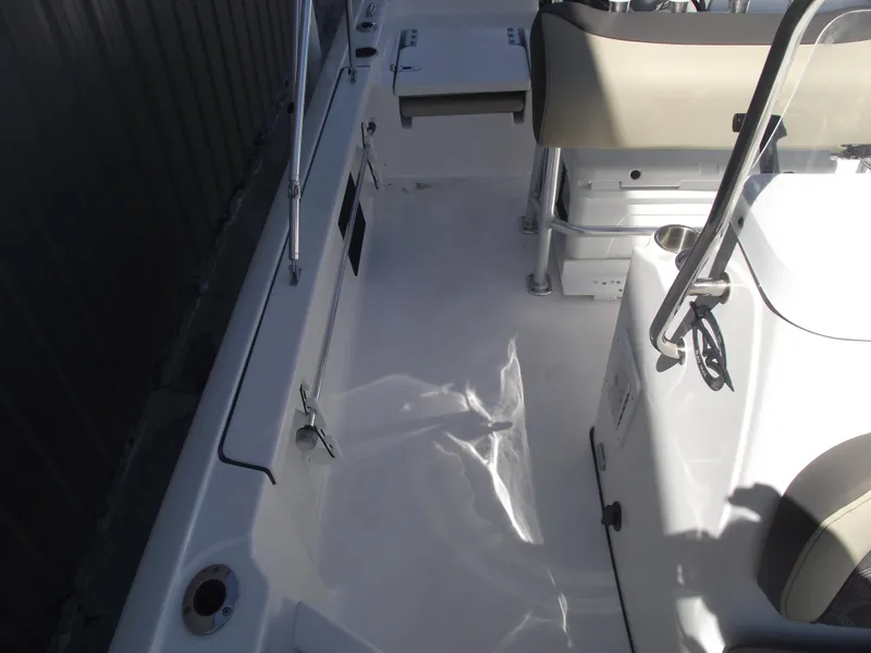 Slide: The Image of 2022 Tidewater 1910 Bay Max boat interior with seating and console. - 15