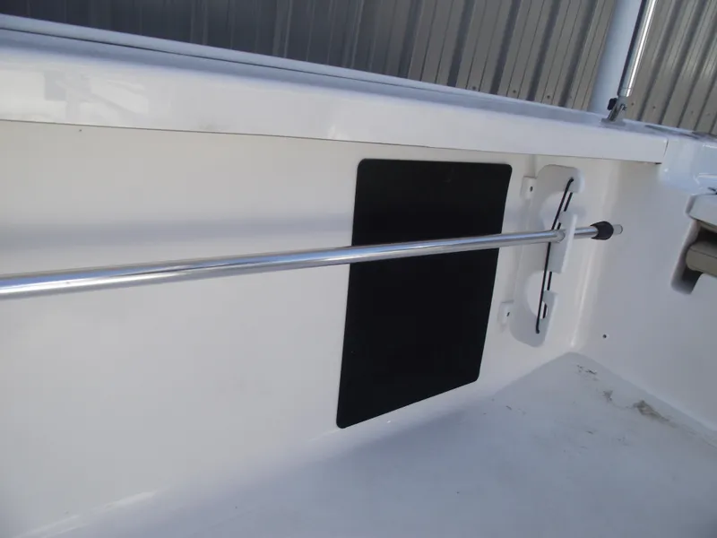 Slide: The Image of Interior view of 2022 Tidewater 1910 Bay Max boat, featuring a sleek metal railing. - 18