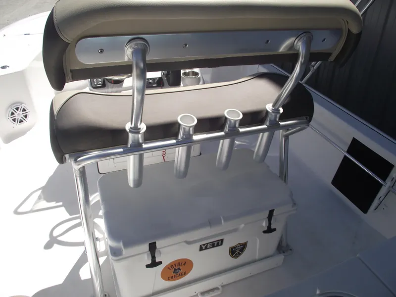 Slide: The Image of 2022 Tidewater 1910 Bay Max boat with rod holders and Yeti cooler on deck. - 27