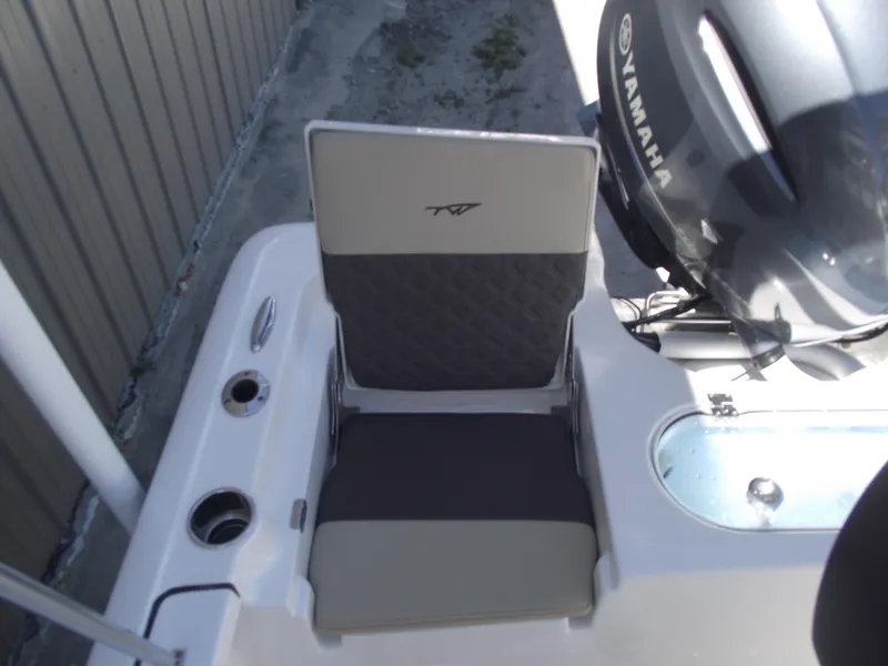 Slide: The Image of 2022 Tidewater 1910 Bay Max boat seat with Yamaha engine, featuring cup holders and storage. - 29