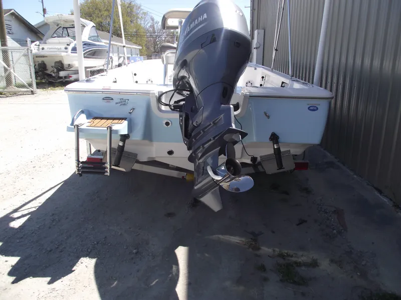 Slide: The Image of 2022 Tidewater 1910 Bay Max boat with Yamaha outboard motor, parked outdoors. - 3