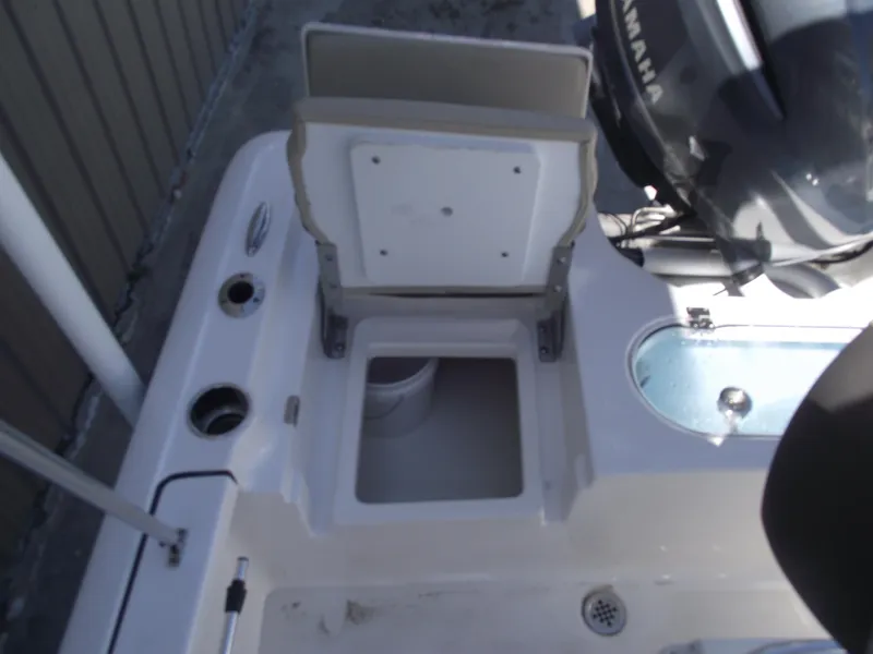 Slide: The Image of 2022 Tidewater 1910 Bay Max boat with open storage compartment and Yamaha engine. - 30