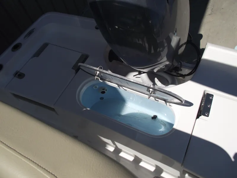 Slide: The Image of 2022 Tidewater 1910 Bay Max boat with open livewell and motor detail. - 35