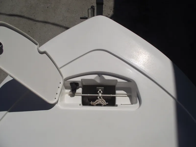 Slide: The Image of 2022 Tidewater 1910 Bay Max boat anchor storage compartment with open lid. - 8