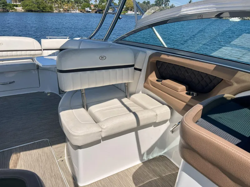 Slide: The Image of 2016 Cobalt 336 boat interior with white seating and lake view. - 13