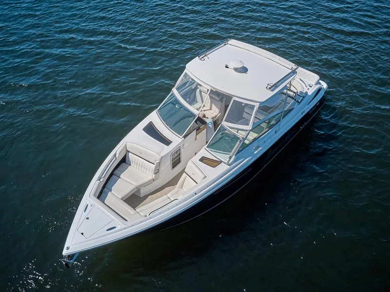Slide: The Image of 2016 Cobalt 336 boat on open water, featuring sleek design and spacious seating. - 2