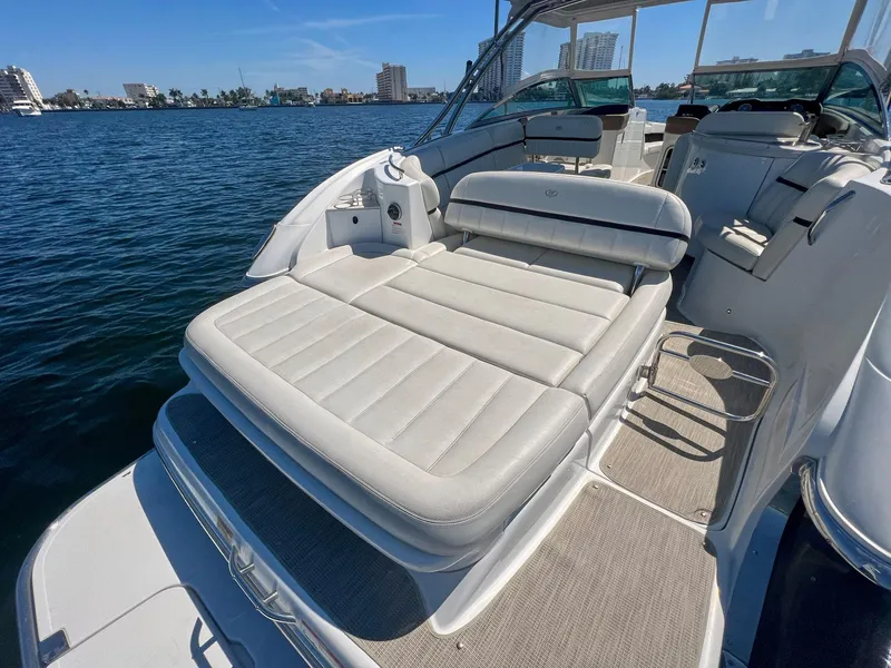 Slide: The Image of 2016 Cobalt 336 boat with spacious sun deck on calm water. - 22