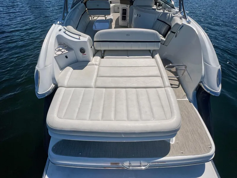 Slide: The Image of 2016 Cobalt 336 boat with spacious sunbed and luxurious seating on calm water. - 23