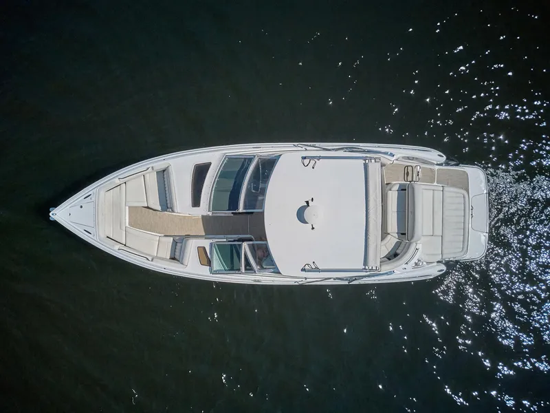 Slide: The Image of Aerial view of 2016 Cobalt 336 boat on water, showcasing sleek design and spacious deck. - 25