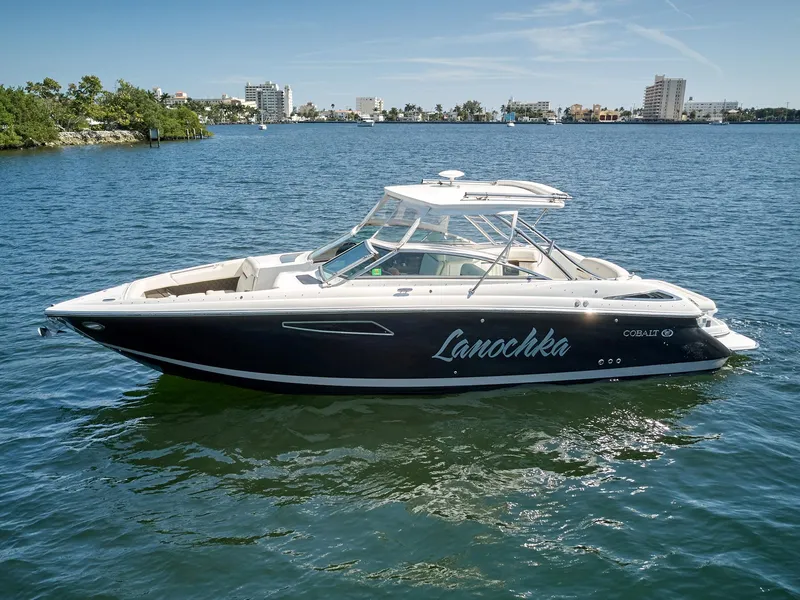 Slide: The Image of 2016 Cobalt 336 boat on water, city skyline in background. - 3
