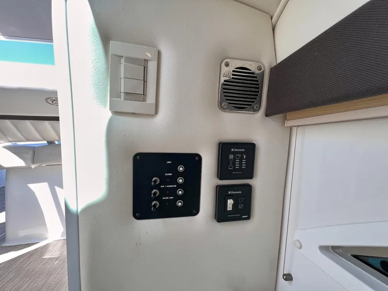 Slide: The Image of Control panel and speaker inside a 2016 Cobalt 336 boat cabin. - 8