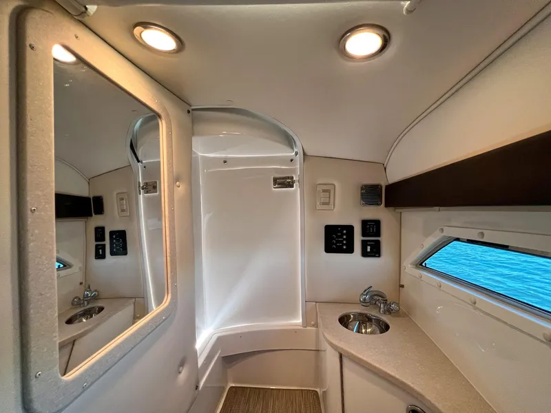 Slide: The Image of Luxurious 2016 Cobalt 336 boat interior with modern bathroom amenities and ocean view. - 9