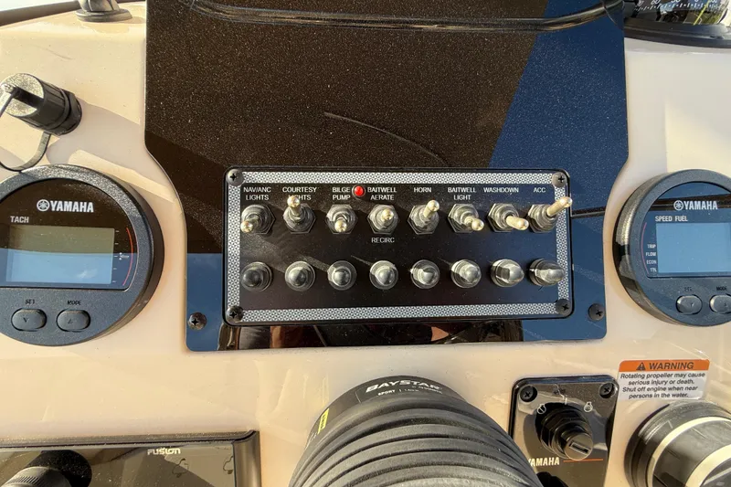 Slide: The Image of Control panel of 2025 Scout 195 Sport Dorado boat with Yamaha gauges and switches. - 18