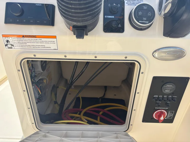 Slide: The Image of Control panel of 2025 Scout 195 Sport Dorado boat with wiring and switches. - 19