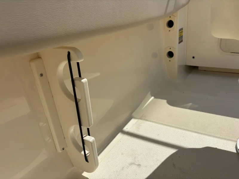 Slide: The Image of 2025 Scout 195 Sport Dorado interior detail with mounted rod holder. - 24